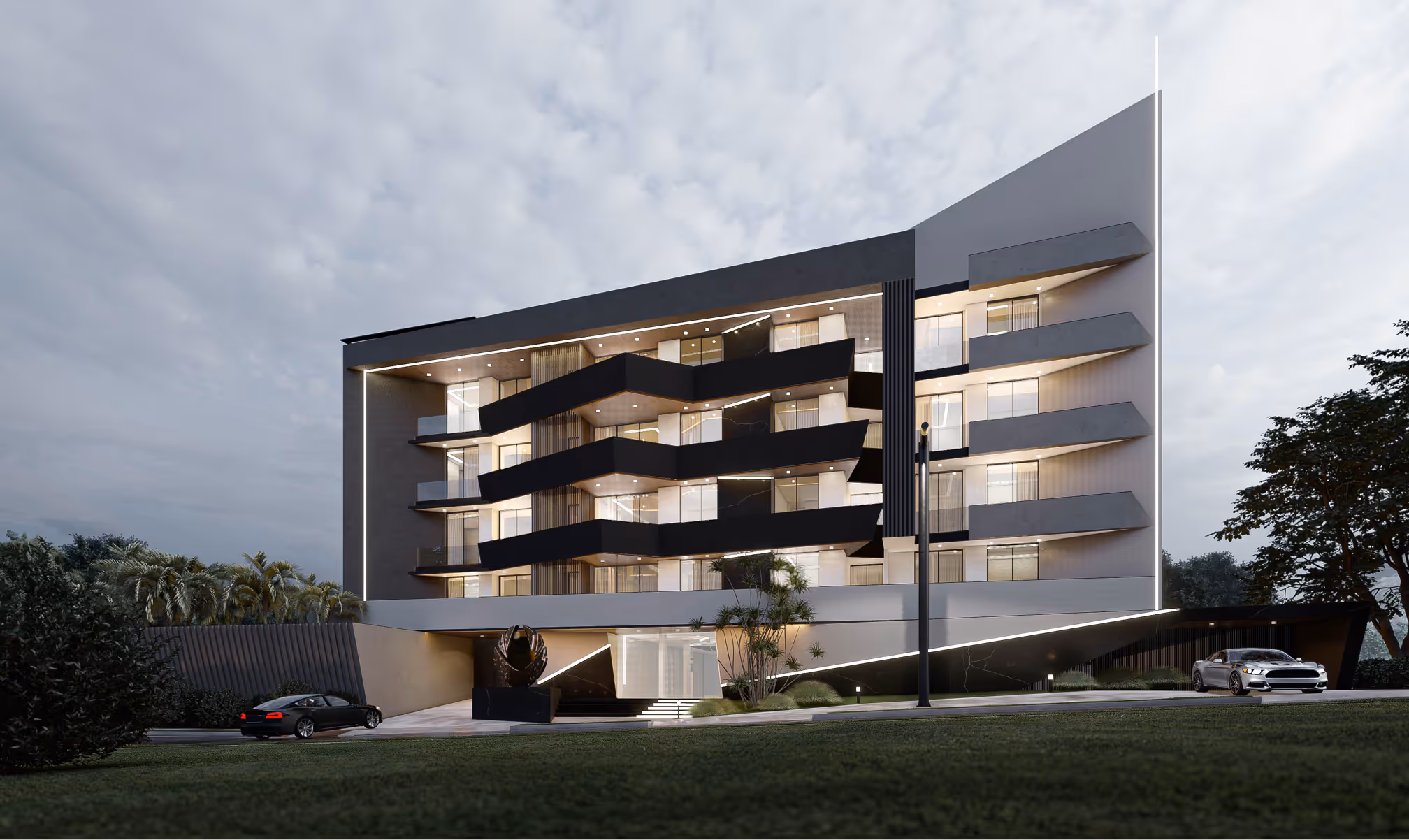 The V4 apartment block at dusk, angular balconies stepping across a dark elevation with the interiors lit.